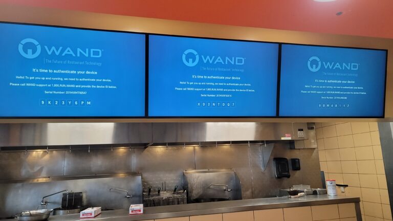 A cashier using a restaurant point-of-sale